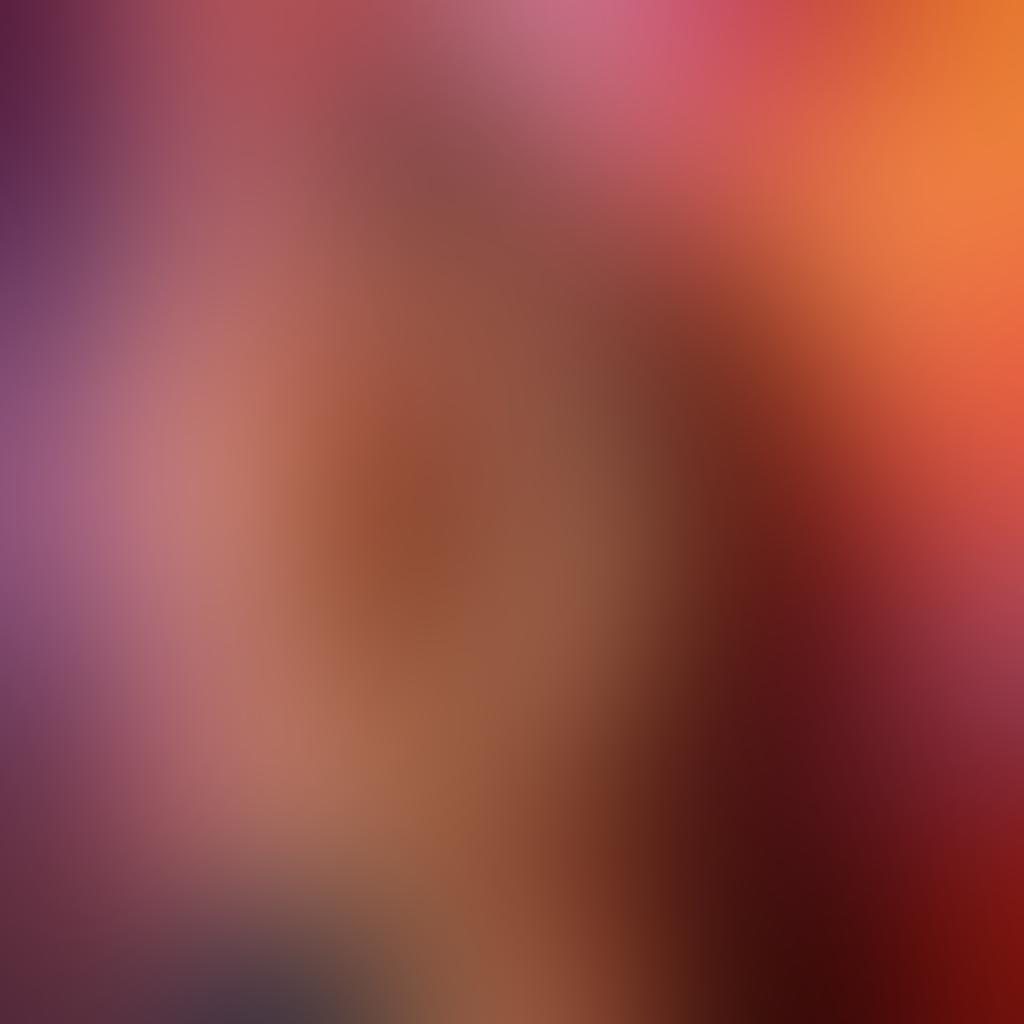 A captivating scene showcasing a sensual couple intertwined in an embrace, surrounded by vibrant and expressive erotic art pieces on the walls. The atmosphere is filled with soft, warm lighting accentuating their confident body language, invoking a sense of intimacy and love. Add abstract shapes and flowing colors to symbolize passion and body confidence. Focus on the intricate details of their expressions and the textures of the artwork. vibrant colors. soft focus. romantic ambiance.